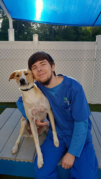 kacper-holding-dog_338x600